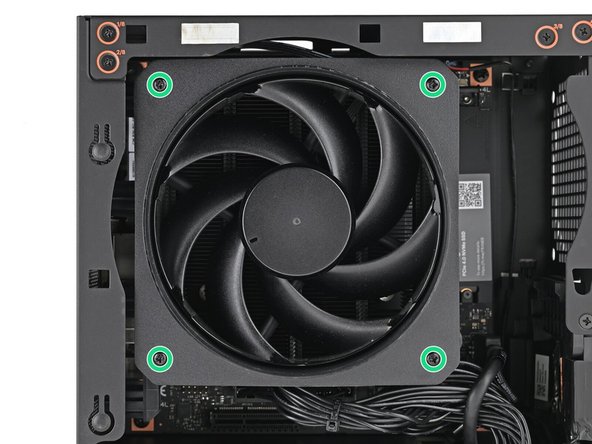 Use your Framework Desktop Screwdriver to install the four 27.3 mm‑long Phillips screws securing the CPU fan and fan duct.