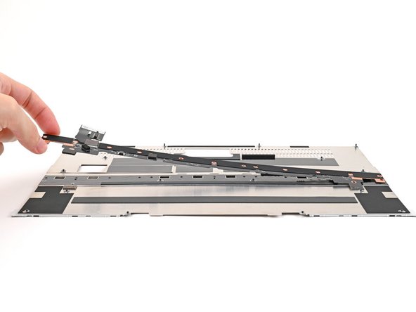Place the Input Module Connector Board on the Mid Plate, making sure the connector is aligned with the hole in the Mid Plate.