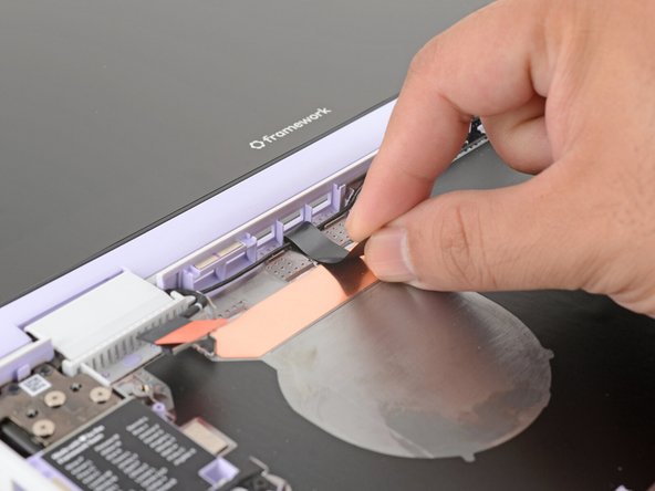 Press the black loop over the antenna cable and onto the Bottom Cover. If it doesn't stick, use a bit of thin double-sided tape to hold it down.