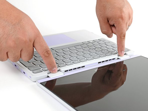 Use your fingers to grip the Input Cover in the hinge cutouts.