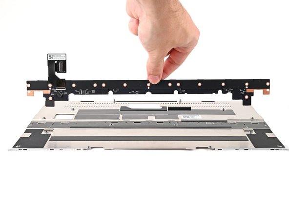 Place the Input Module Connector Board on the Mid Plate, making sure the connector is aligned with the hole in the Mid Plate.