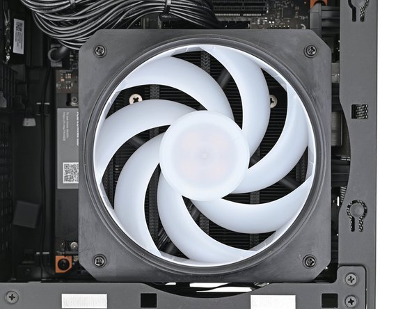 Use your Framework Desktop Screwdriver to install the four 27.3 mm‑long Phillips screws securing the fan and fan duct.