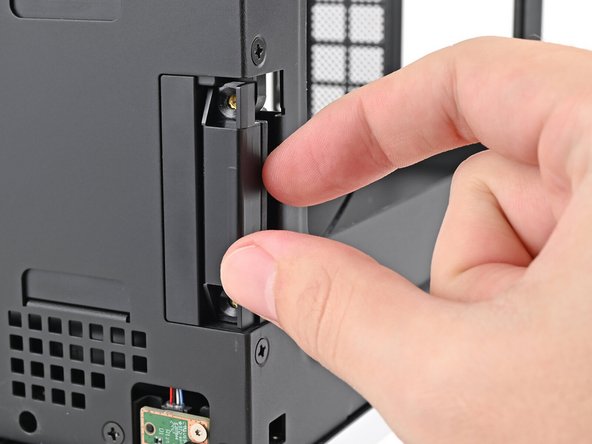 Lift the right antenna out of the chassis, making sure to thread the cable through the slot.