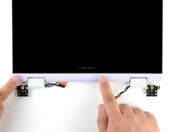 Use your finger to press along the length of the Display Cover to snap it onto the laptop.