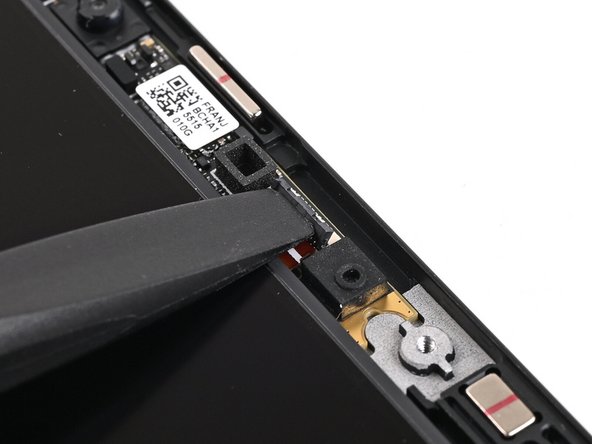 Use the flat end of your Framework Screwdriver, or a clean fingernail, to lift up the locking tab on the Webcam ZIF connector.