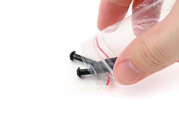 Remove the fan screws from their packaging and make sure there are four screws total.