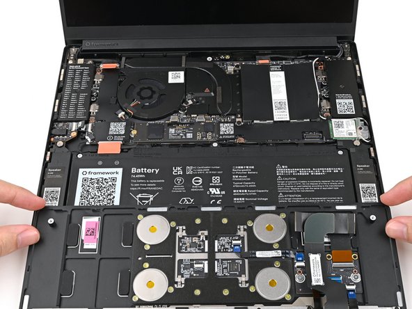Position the Input Cover, keyboard down, on top of the laptop so it just covers the Battery.