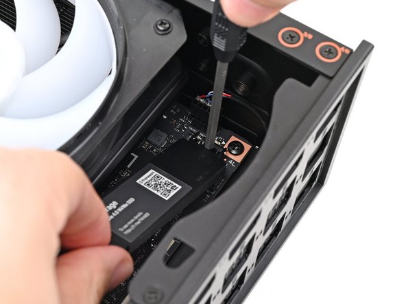 If your replacement SSD comes with a pre-installed heat spreader, follow the next two steps. Otherwise skip this and the following step.