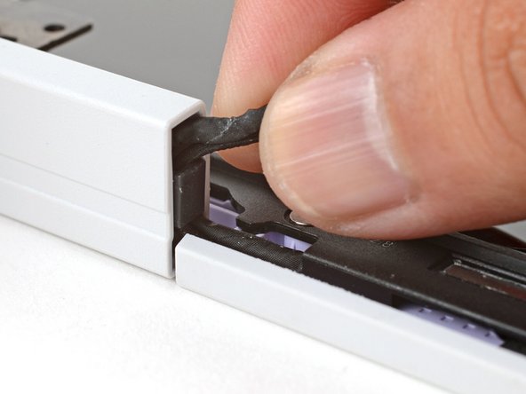 Use your fingers to grab the two cables coming out of the left hinge.