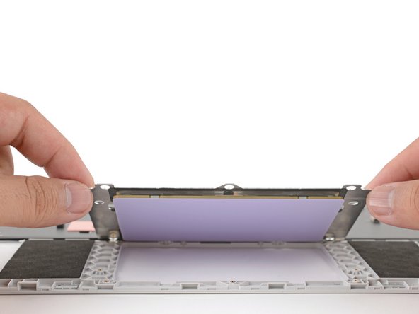 Lift and remove the touchpad.