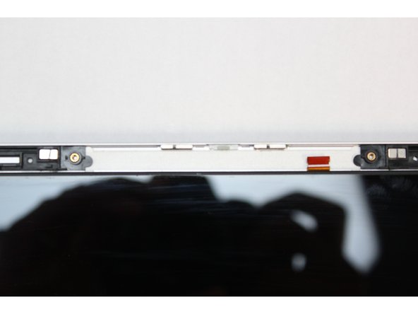 The Webcam Module is now fully disconnected from the Top Cover.