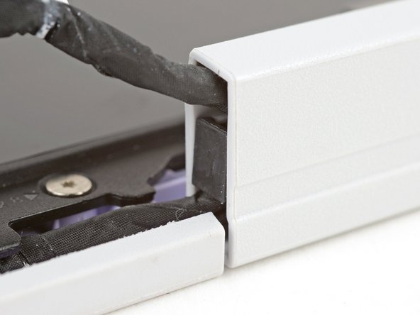 Make sure both cable clips are fully inserted into the hinges, so that they won't be snagged when the hinges pivot.