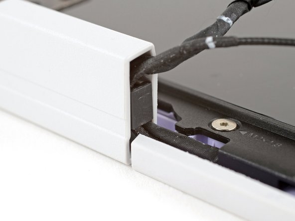 Make sure both cable clips are fully inserted into the hinges, so that they won't be snagged when the hinges pivot.