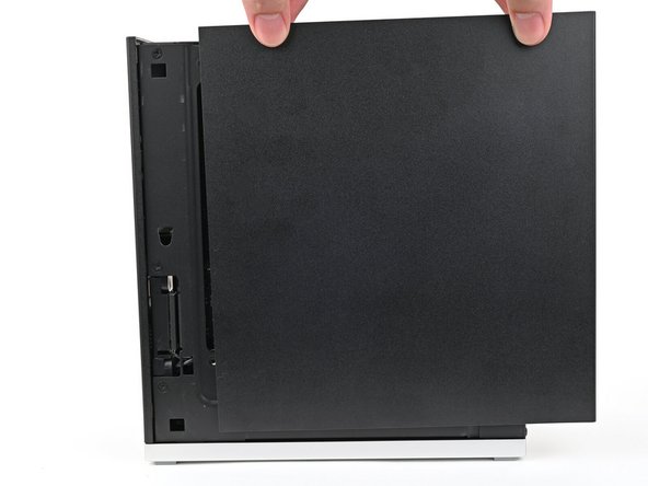 Slide the Right Panel onto the right edge of the chassis, from top to bottom, and press it flat to ensure its clips are slotted into place.