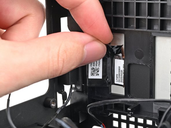 Use your fingers to peel the right antenna's copper film off the chassis.