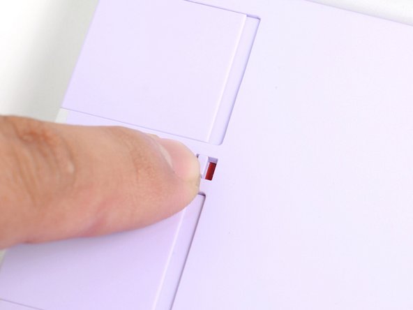 Use your fingers to flip the two Expansion Card latches (one for each side) into the unlocked position.