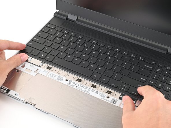 Make sure the keyboard is seated properly on its alignment pegs and sits flush with the edges of the laptop.