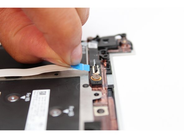 Slide the cable straight in until the white line is almost at the edge of the connector.