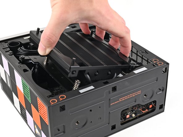 When handling the Heatsink, be sure to grab from the left and right side (sides facing Front Panel &amp; Back IO) as to prevent bent fins and damage to the Heatsink.
