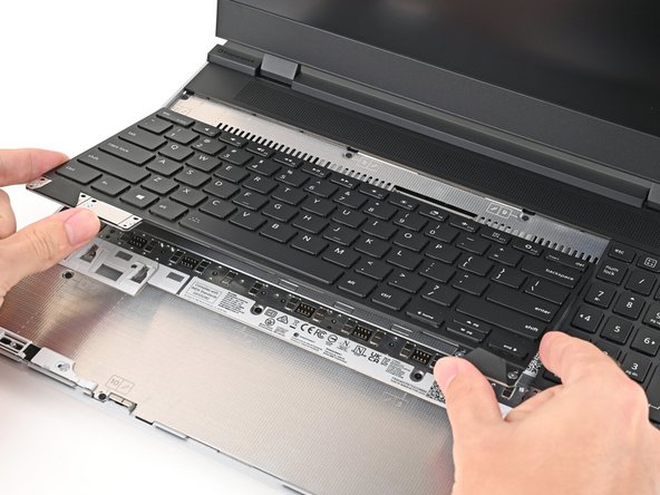 Align the top edge of the keyboard with the top edge of the laptop.