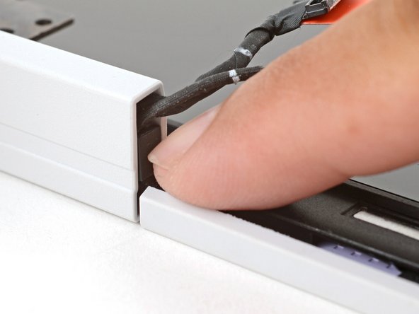 Repeat the procedure on the left hinge to secure the left cables.