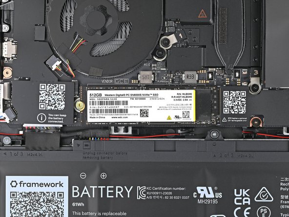 The SSD might pop up at a shallow angle when you remove the screw.