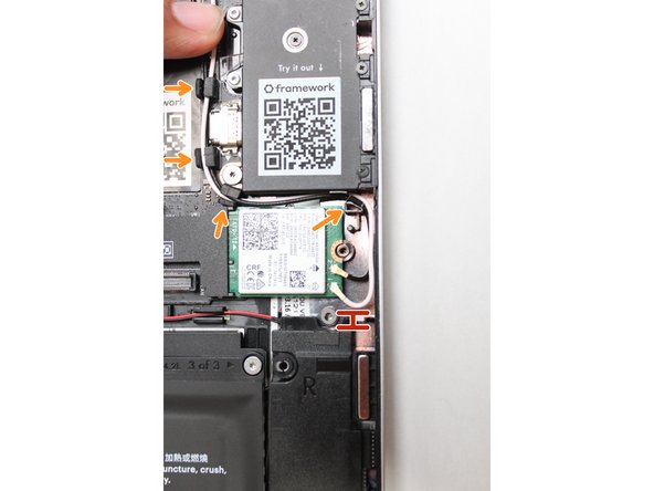 Once the module is properly inserted into the Mainboard, carefully route both the black and white WiFi Antenna cables into the black rubber routers as indicated in the first image.  Place both the cables  behind the metal structure located near the top right of the WiFi module as well.