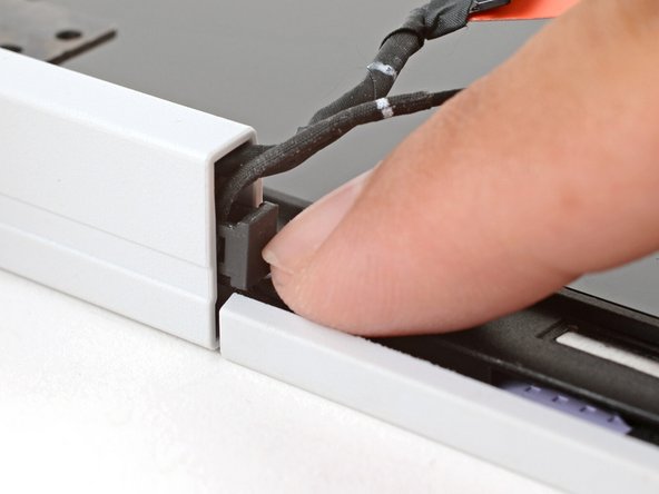 Repeat the procedure on the left hinge to secure the left cables.