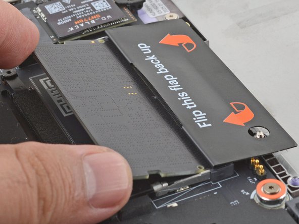 Orient the module with the label facing down and align the gold contacts with the socket.