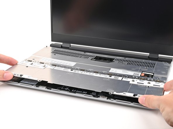 Place the Mid Plate on the laptop, making sure it sits evenly on its alignment pegs.