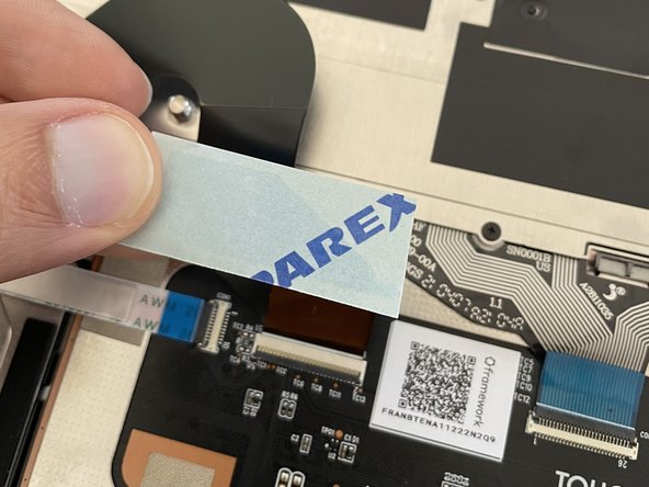 Note, if your double-sided tape wasn't provided by Framework, it may be a different shape or color than what is in the image.  The instructions should remain the same though.  If you are bringing your own tape, we recommend a 12mmx12mm (about 0.5&quot;x0.5&quot;) square of 3M 9495LE.