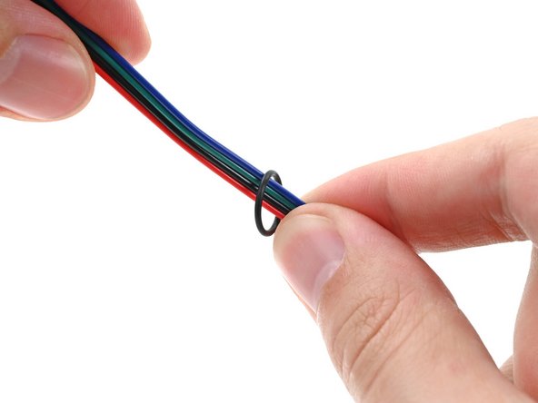 Thread the O-ring over the power button cable and slide it down the length of the cable.