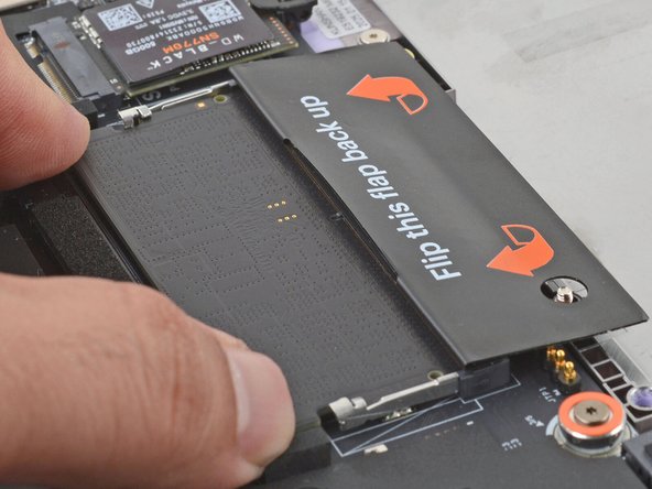 Insert the contact edge into the socket at a shallow angle. The gold contacts should mostly be covered by the socket.