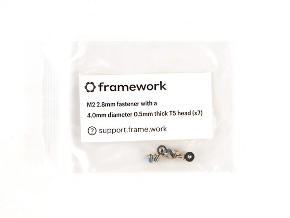 Use the silver screws labeled "M2 2.8mm fastener with a 4.0mm diameter 0.5mm thick T5 head" to secure the webcam.