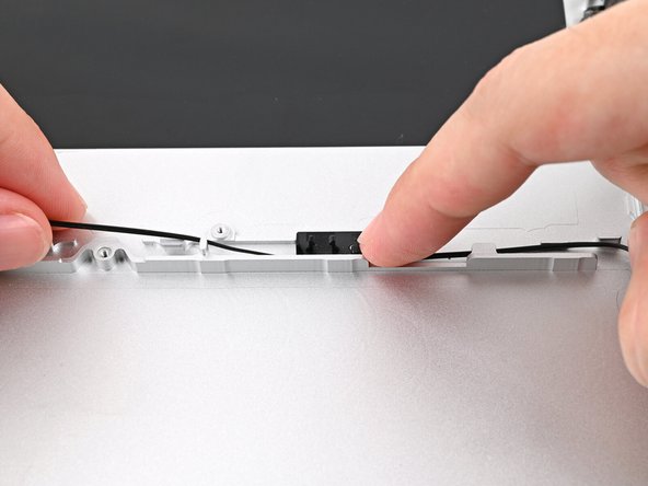 Pull the cable taut against the Bottom Cover as you do this, as you'll need slack along the left edge.