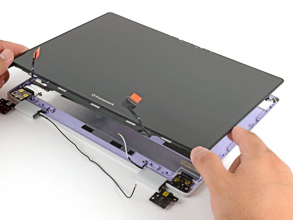 Lay the display in place in the Top Cover, such that the top edge of the display is slightly below the top edge of the Top Cover.