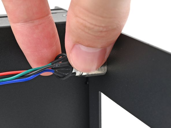 Slide the O-ring over the threads of the power button so it sits close to the front of the Tray.