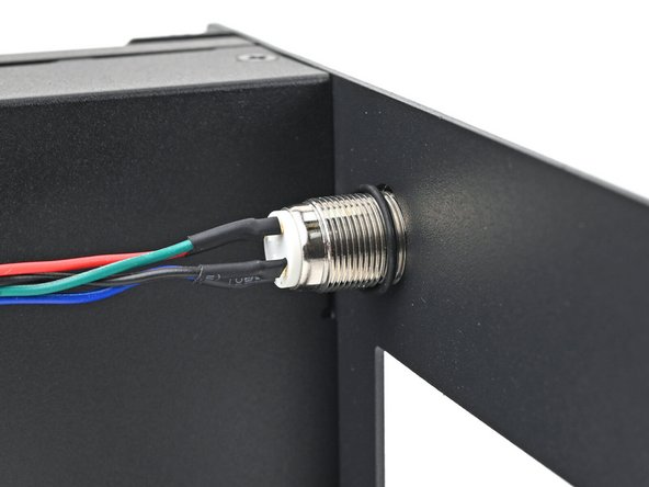 Slide the O-ring over the threads of the power button so it sits close to the front of the Tray.