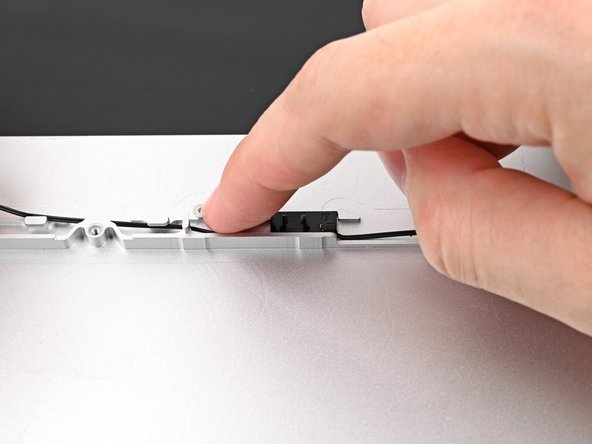 Pull the cable taut against the Bottom Cover as you do this, as you'll need slack along the left edge.