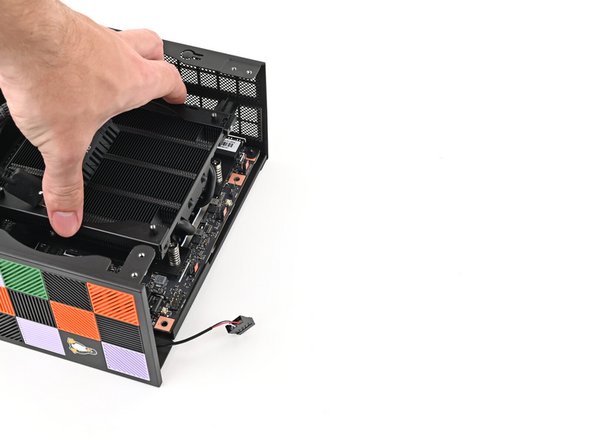 Align the rear ports with its cutout and the screw posts with the screw holes on the Mainboard.