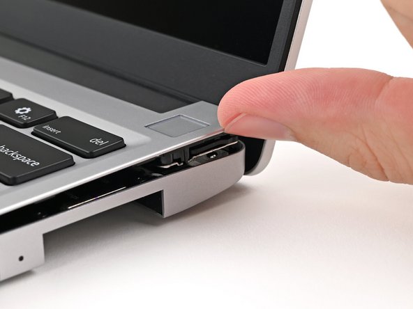 Use your fingers to lift the Input Cover up and release it from its magnets.