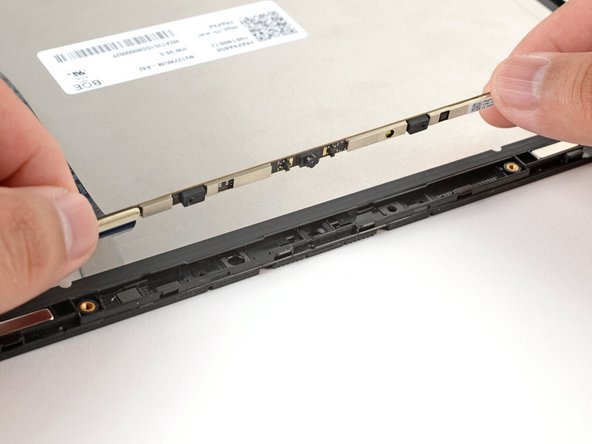 Insert the webcam back into its display recess.