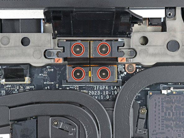 If you have the Graphics Module installed, your interposer will have four screws. If you have the Expansion Bay Shell installed, you'll have three screws instead.
