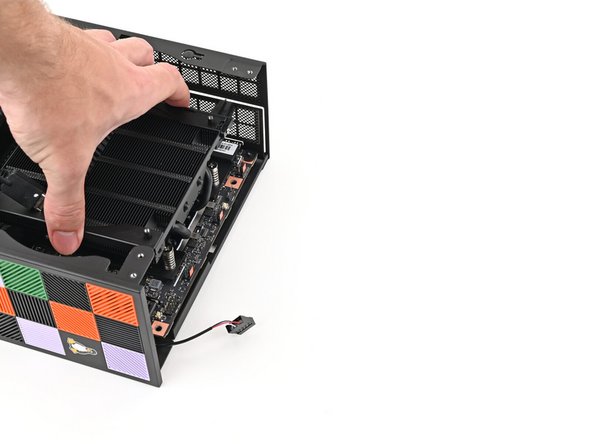 When handling the Heatsink, grab from the left and right sides (sides facing Front Panel &amp; Back IO) as shown in the image to prevent bent fins and possible damage to the Heatsink.