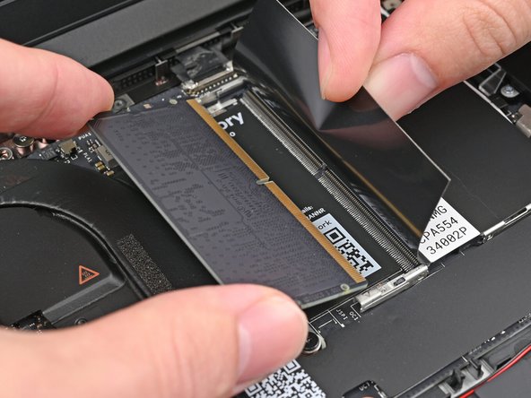 Slide the memory module out of its socket and remove it.