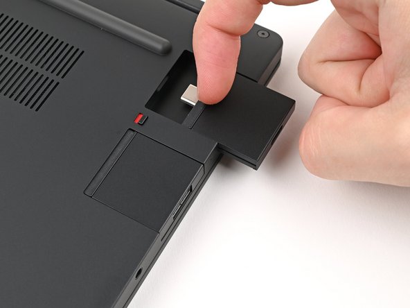 Grip the lip of the Expansion Card with your fingers.
