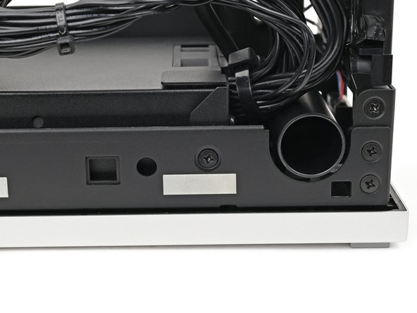 Use your Framework Desktop Screwdriver to install the 4.0 mm‑long Phillips screw securing the power supply.