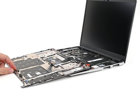 Rest the Input Cover over the Battery, making sure the Touchpad Cable isn't being strained.