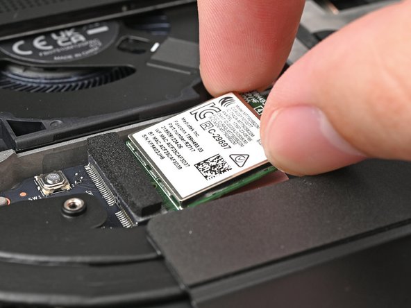 Align the Wi-Fi module's gold contacts and notch with the socket on the Mainboard.