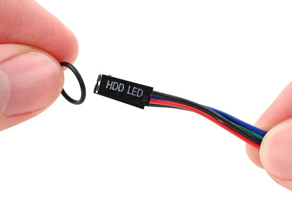 Thread the O-ring over the power button cable and slide it down the length of the cable.